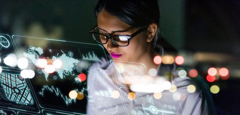 Woman looking at digital holographic dashboad